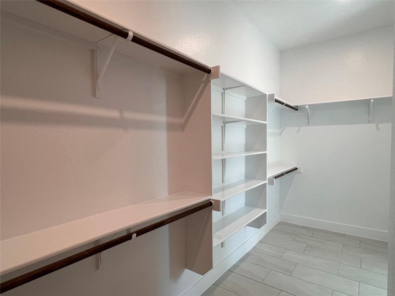 Walk in closet featuring wood tiled floors