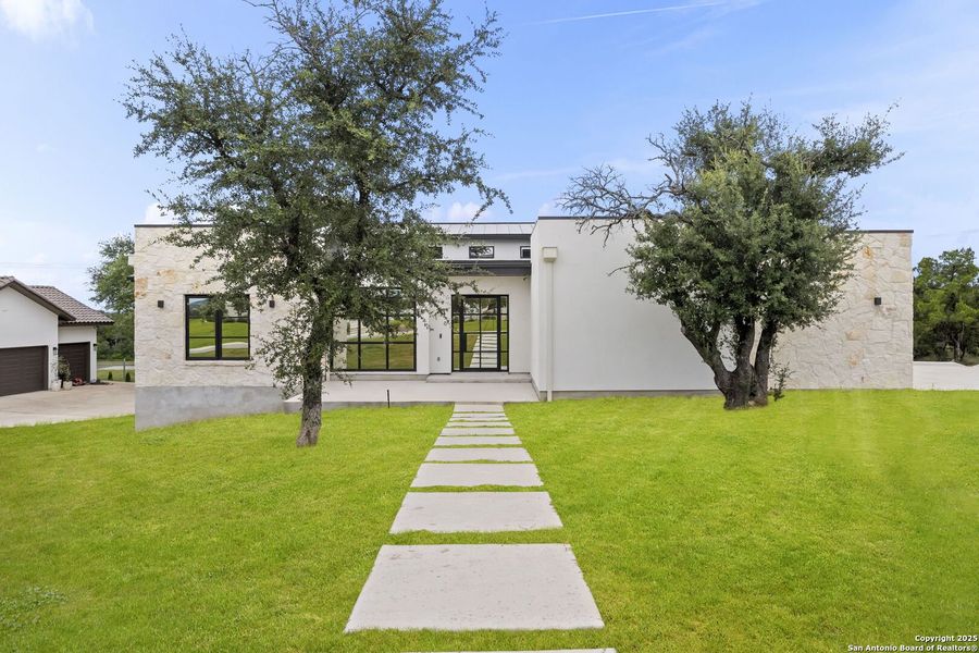 Front exterior of a new home in , San Antonio, TX, highlighting curb appeal (Image 25).