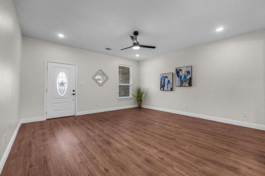 Foyer entrance featuring hardwood / wood-style floors and ceiling fan