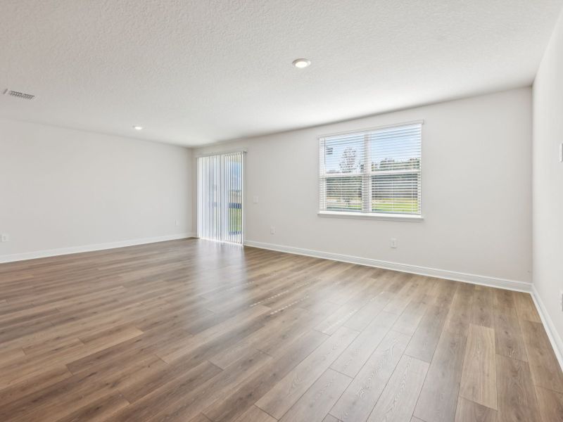 Spacious, unfurnished interior of a new home in The Reserve at Hammock Oaks - Signature Series, Lady Lake (Image 10).