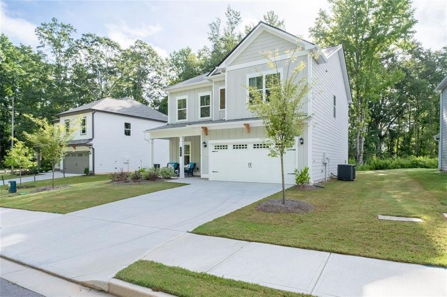 Front exterior of a new home in Morgan Landing, Carrollton, GA, highlighting curb appeal (Image 30). Front exterior of a new home in Morgan Landing, Carrollton, GA, highlighting curb appeal (Image 30).