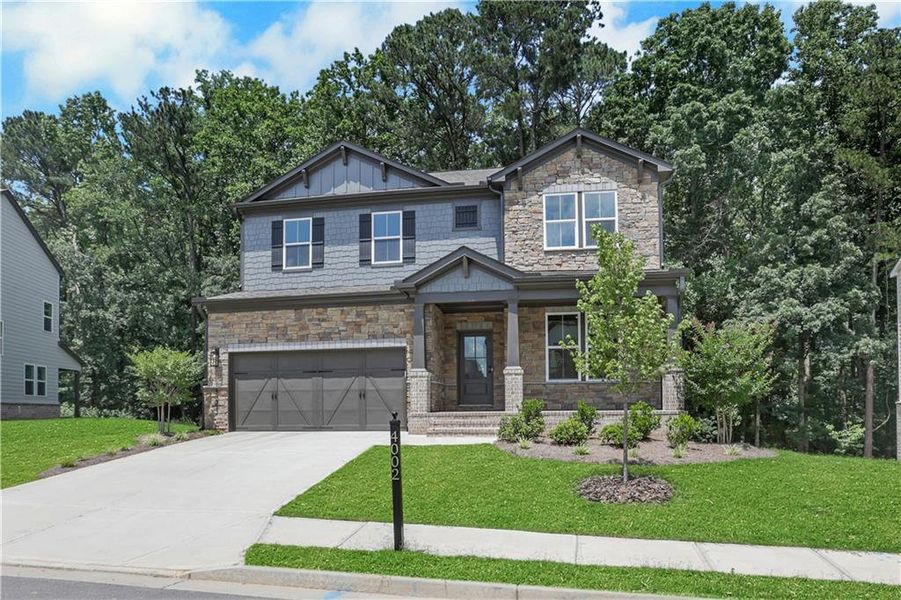 Front exterior of a new home in The Paddocks at Doc Hughes, Buford, GA, highlighting curb appeal (Image 2). Front exterior of a new home in The Paddocks at Doc Hughes, Buford, GA, highlighting curb appeal (Image 2).