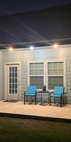 Patio at twilight with a patio area Patio at twilight with a patio area