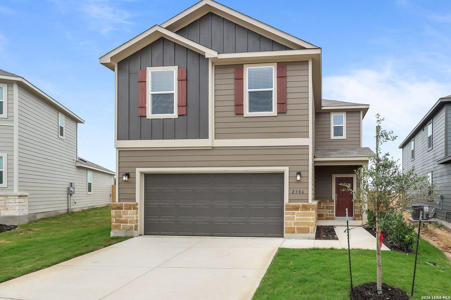 Front exterior of a new home in Applewhite Meadows, San Antonio, TX, highlighting curb appeal (Image 1). Front exterior of a new home in Applewhite Meadows, San Antonio, TX, highlighting curb appeal (Image 1).