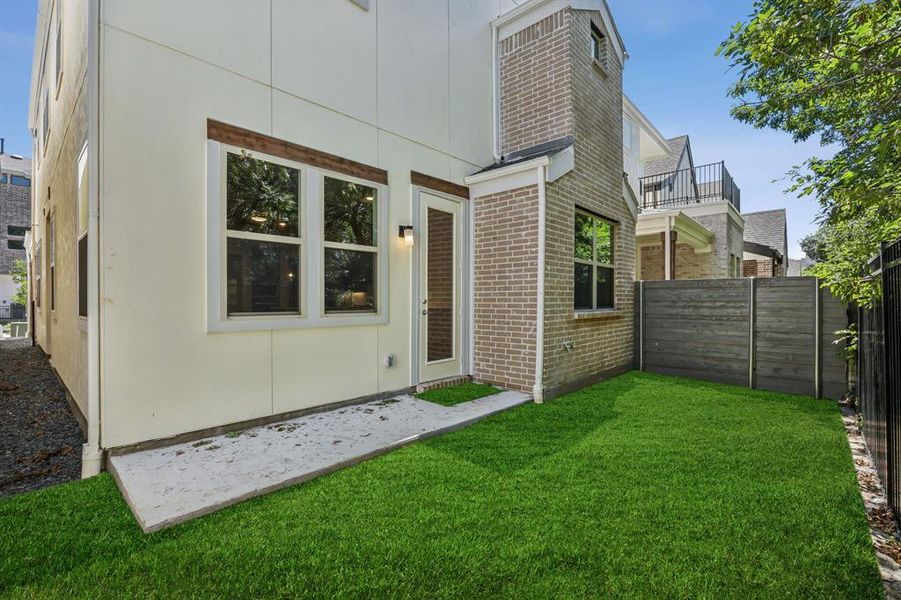 View of yard featuring a balcony