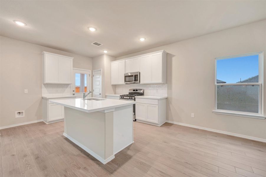 Furnished interior view inside a new home in Carillon, Manor (Image 6).