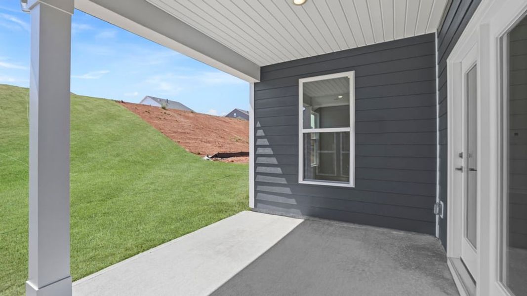 Exterior details and patio area of a home in Whitehawk Meadows, Travelers Rest (Image 3). Exterior details and patio area of a home in Whitehawk Meadows, Travelers Rest (Image 3).
