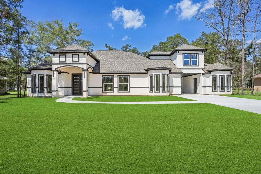 Front exterior of a new home in , Dayton, TX, highlighting curb appeal (Image 1). Front exterior of a new home in , Dayton, TX, highlighting curb appeal (Image 1).