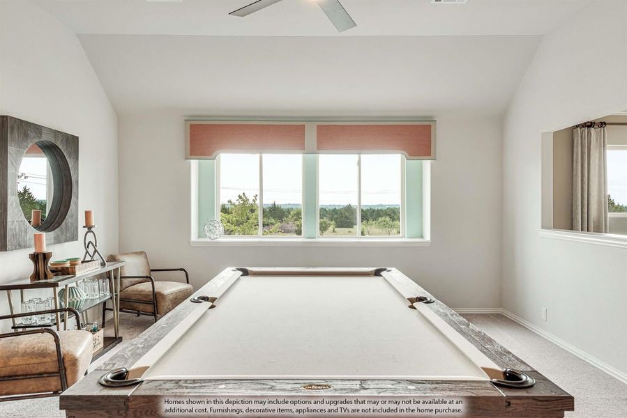 Game room with pool table, vaulted ceiling, and large windows overlooking trees