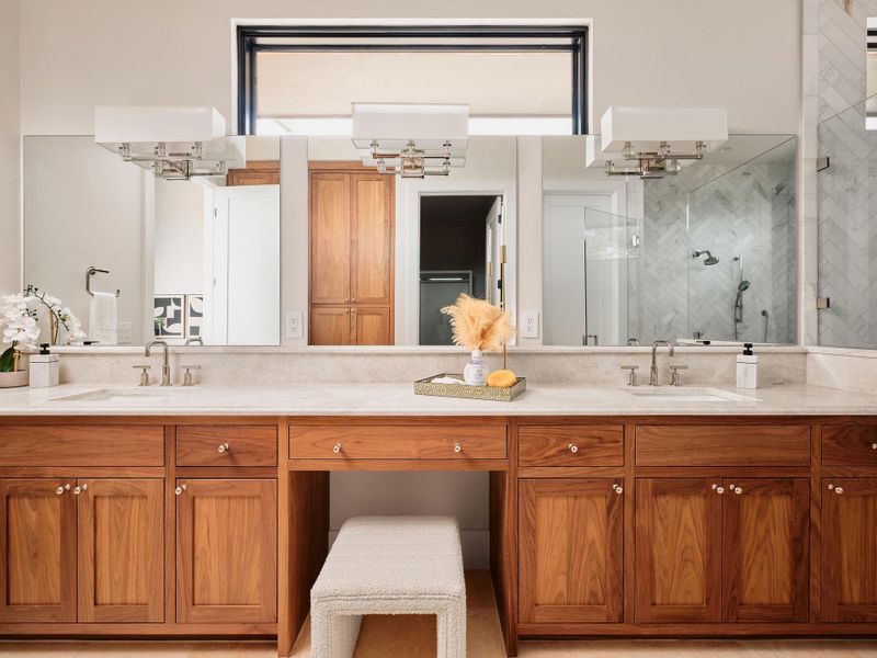 Refined wood cabinetry contrasts beautifully with bright white countertops, creating a harmonious and functional space. Refined wood cabinetry contrasts beautifully with bright white countertops, creating a harmonious and functional space.