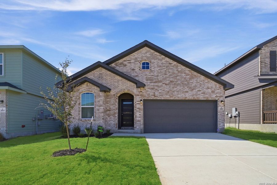 Front exterior of a new home in Laurel Vistas, San Antonio, TX, highlighting curb appeal (Image 20).