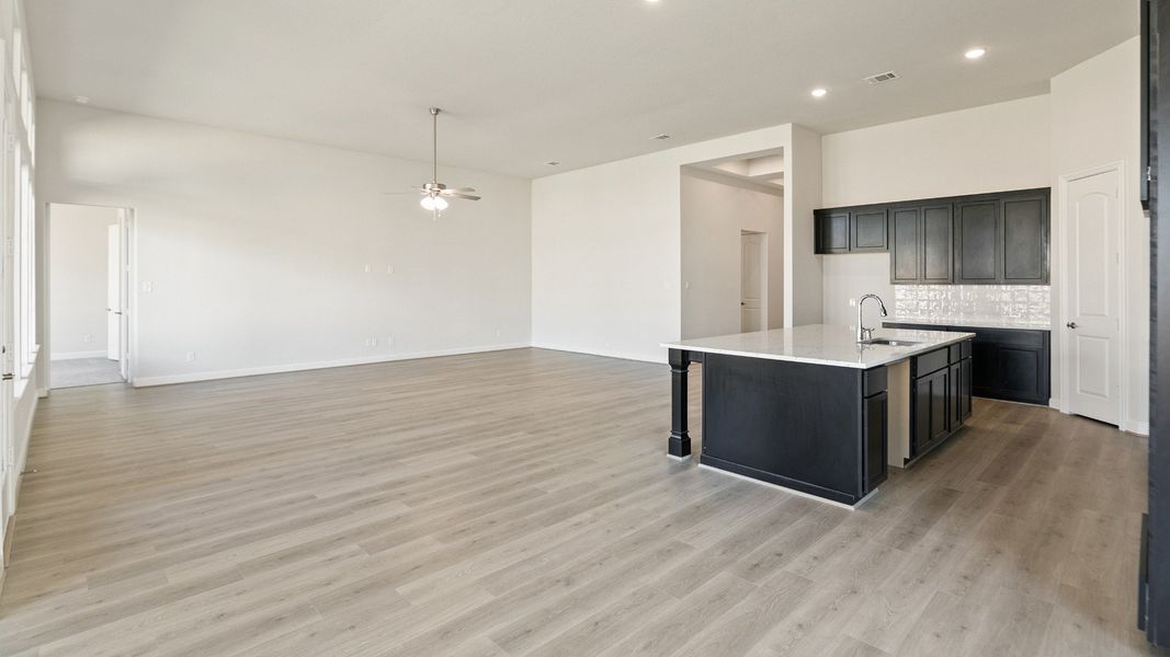 Representative furnished interior of a home built from the Yale by DRB Homes in Creekhaven, Iowa Colony (Image 9).