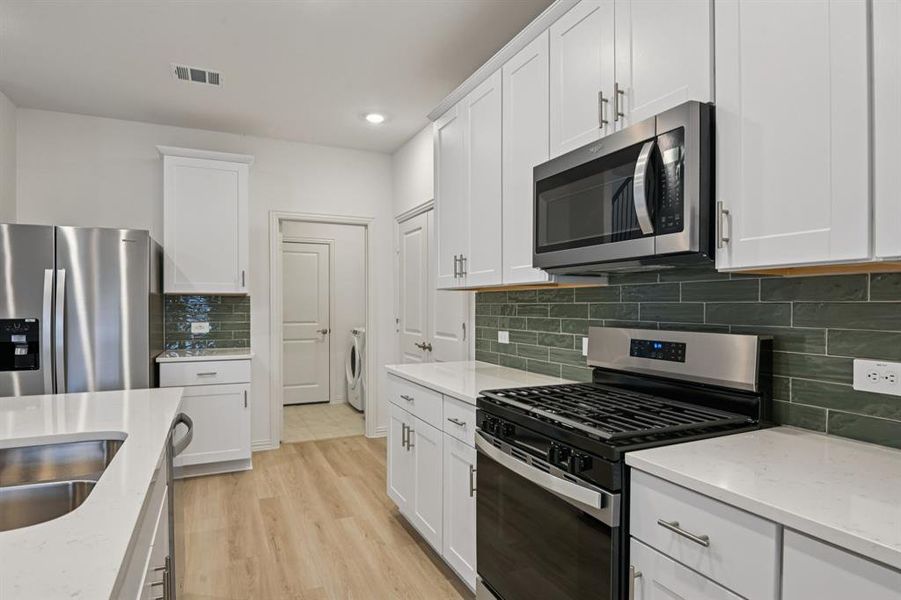 Furnished interior view inside a new home in Lakehaven - Spring Series, Farmersville (Image 15).