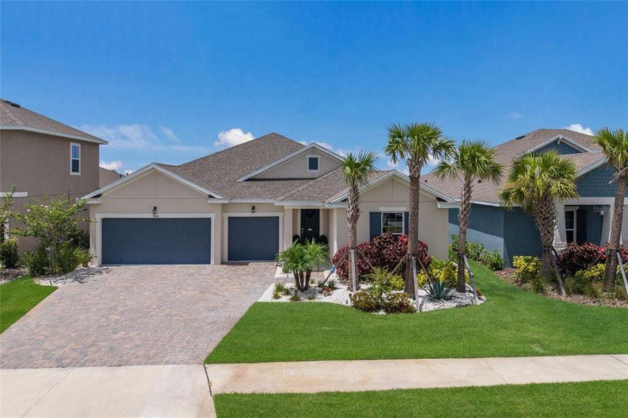 Front exterior of a new home in Seaire, Parrish, FL, highlighting curb appeal (Image 26). Front exterior of a new home in Seaire, Parrish, FL, highlighting curb appeal (Image 26).