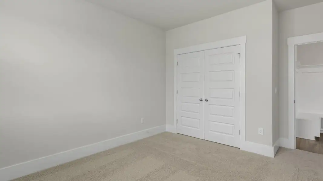 Spacious, unfurnished interior of a new home in The Highlands at Cedar Hill Landing, Navassa (Image 21).