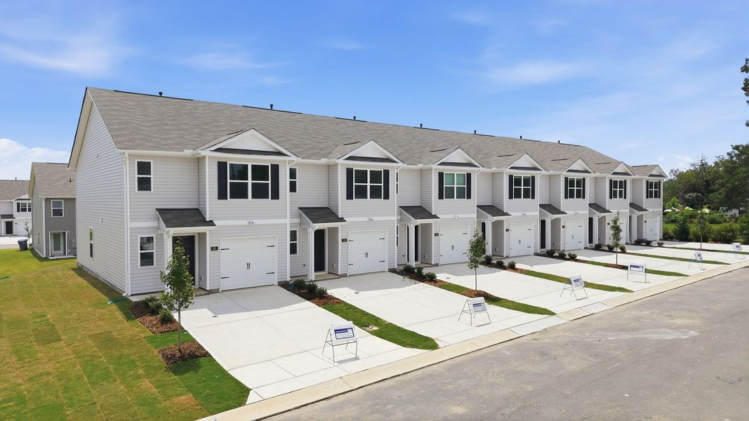 Front exterior of a new home in The Townes at Hunter Hill, Rocky Mount, NC, highlighting curb appeal (Image 23). Front exterior of a new home in The Townes at Hunter Hill, Rocky Mount, NC, highlighting curb appeal (Image 23).