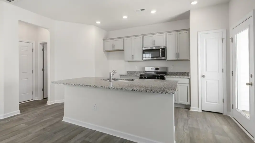 Furnished interior view inside a new home in The Townes at Ridgewood Farms, Winterville (Image 5).