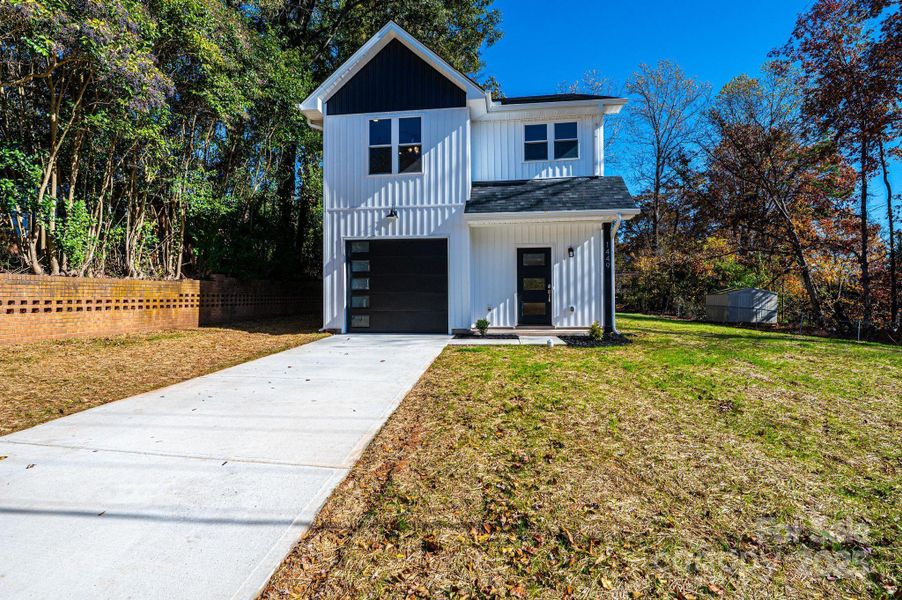 Front exterior of a new home in , Hickory, NC, highlighting curb appeal (Image 1).