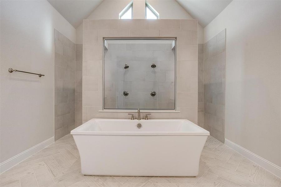 Bathroom with independent shower and bath and lofted ceiling