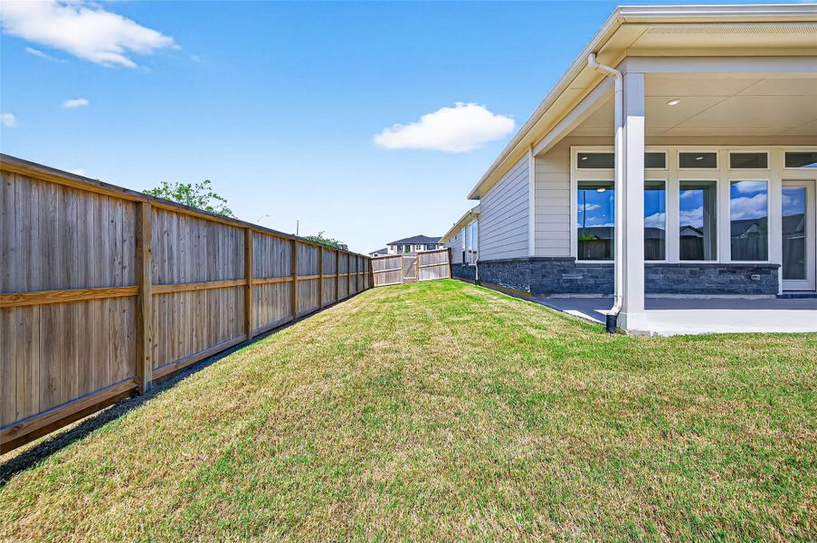 Exterior details and patio area of a home in Jordan Ranch: Signature Series, Katy (Image 2).