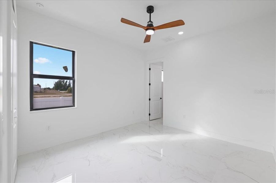 Spacious, unfurnished interior of a new home in , Port Charlotte (Image 13).