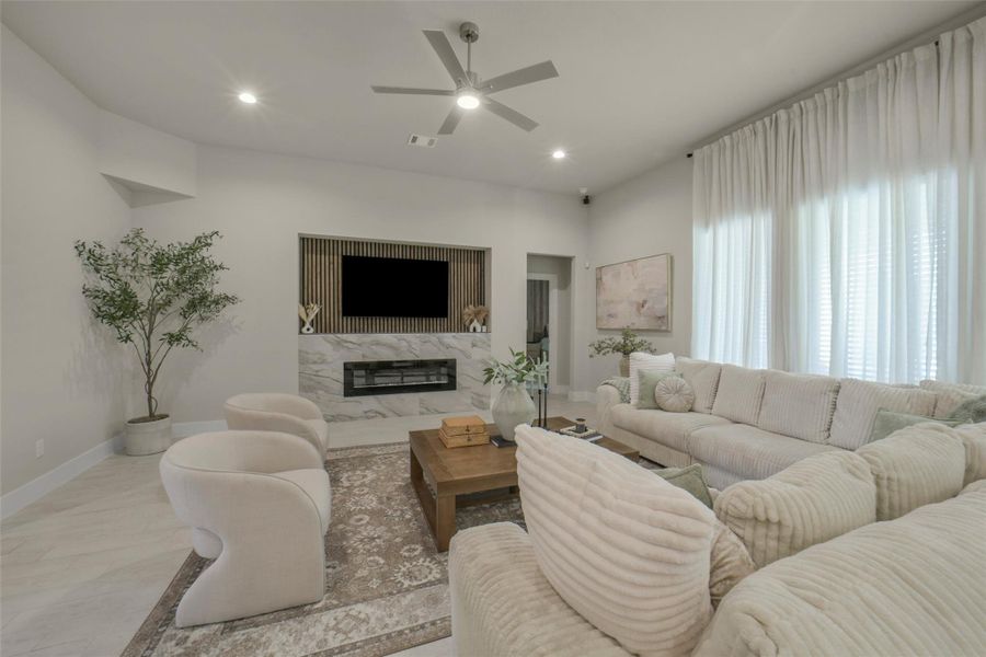 Stylish living area with high ceilings and modern finishes.