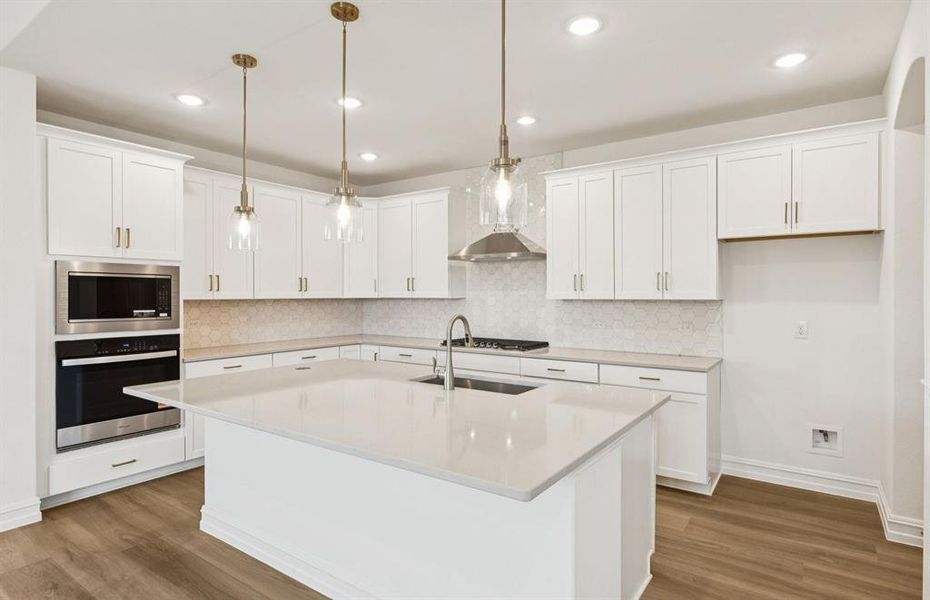 Large island overlooking gathering room and dining areas Large island overlooking gathering room and dining areas