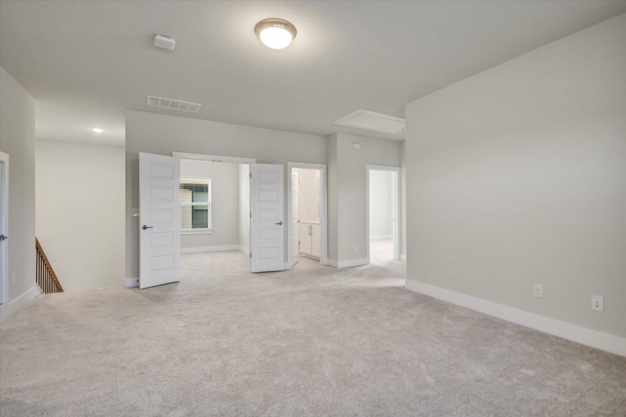 Plush carpet and soft neutral walls define this versatile upper-level bonus space. Plush carpet and soft neutral walls define this versatile upper-level bonus space.