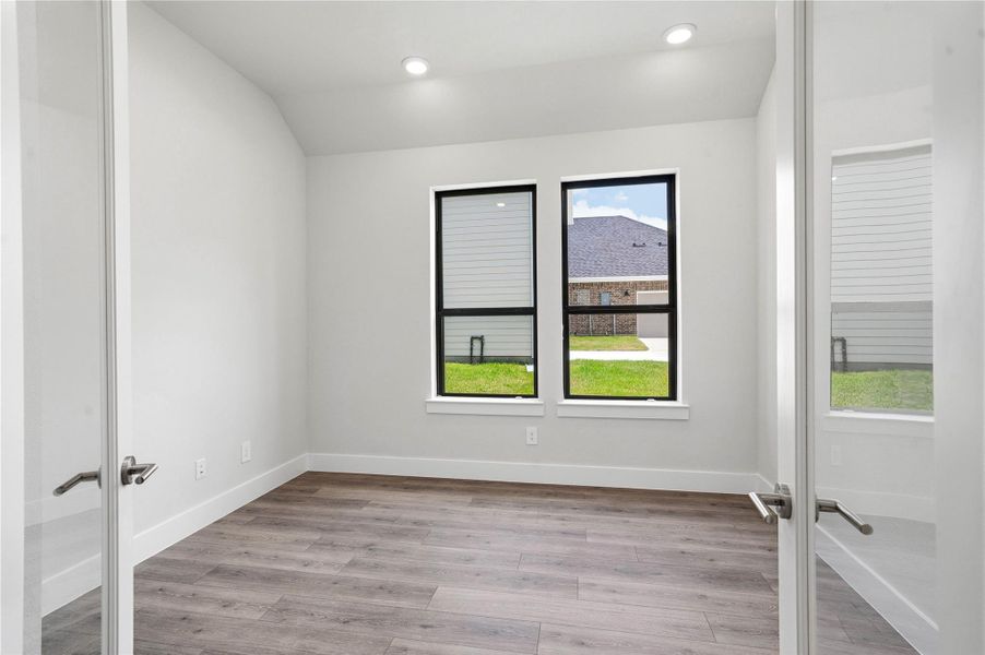 The Study offers a quiet workspace with LVP flooring, high ceilings, double French doors for added privacy, large windows, and custom paint for a polished finish. The Study offers a quiet workspace with LVP flooring, high ceilings, double French doors for added privacy, large windows, and custom paint for a polished finish.