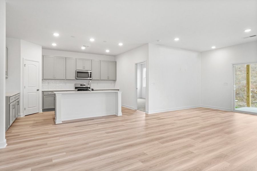 A large kitchen with white cabinets.