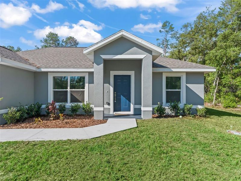 Front exterior of a new home in , Ocala, FL, highlighting curb appeal (Image 21).