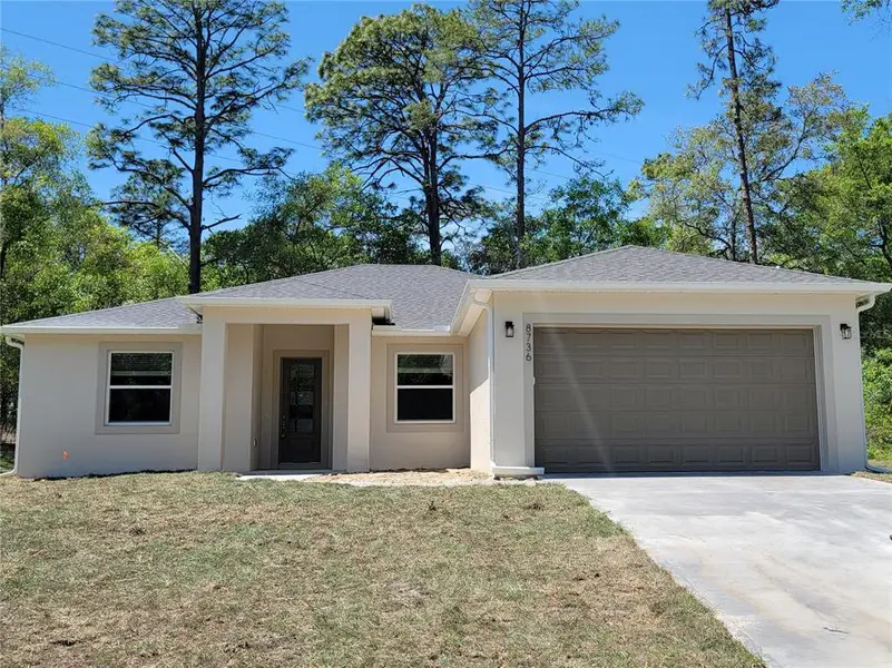 Front exterior of a new home in , Dunnellon, FL, highlighting curb appeal (Image 22).