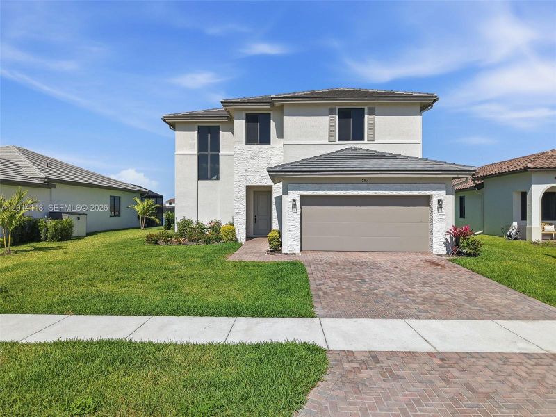 Front exterior of a new home in , Immokalee, FL, highlighting curb appeal (Image 2). Front exterior of a new home in , Immokalee, FL, highlighting curb appeal (Image 2).