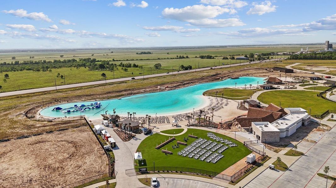 Experience resort-style living every day with this breathtaking crystal-clear lagoon! Enjoy white sand beaches, shaded lounging areas, and scenic walking paths—all within your own neighborhood. A true destination right at home.