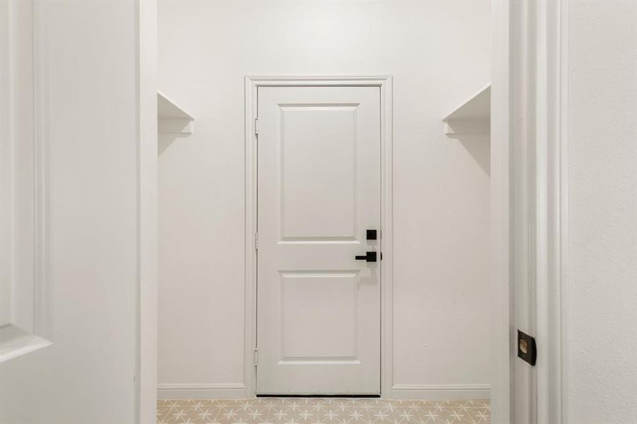 Spacious closet featuring light tile patterned floors