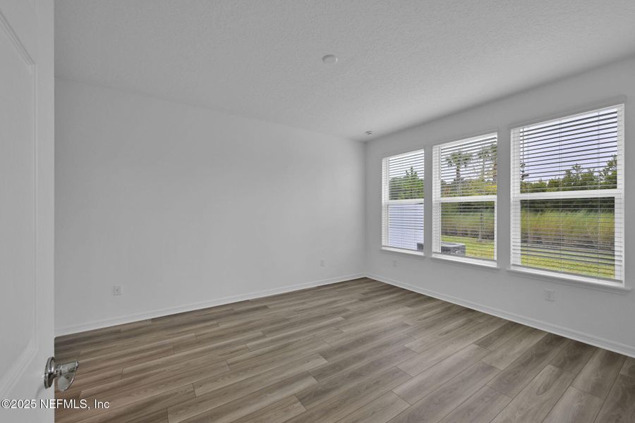 Spacious, unfurnished interior of a new home in Del Webb Wildlight, Yulee (Image 25).