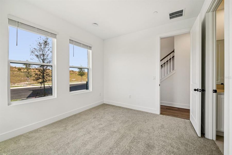 Spacious, unfurnished interior of a new home in Parkview at Hamlin, Winter Garden (Image 43).