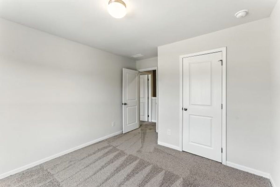 Representative unfurnished interior of a home built from the Brentwood by Piedmont Residential in Falls Creek, Flowery Branch (Image 29).