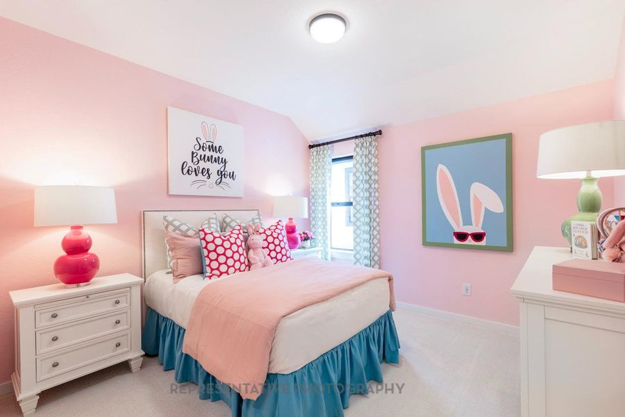 Bedroom featuring light carpet and baseboards Bedroom featuring light carpet and baseboards