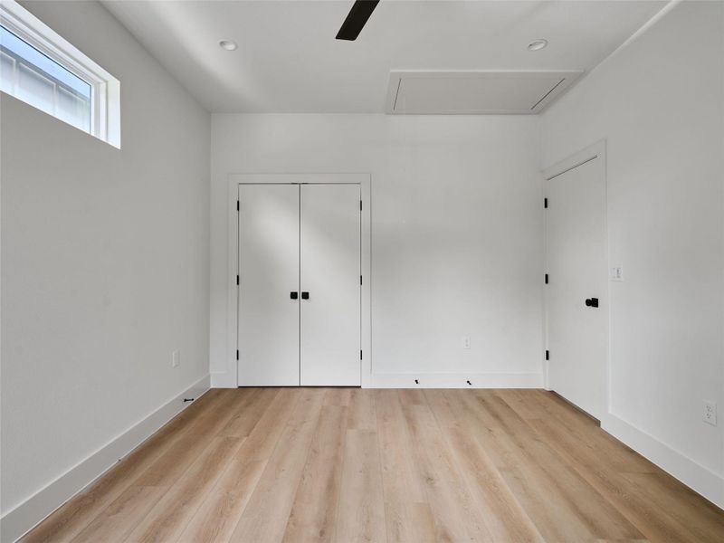 Unfurnished bedroom with light wood-style floors, ceiling fan, recessed lighting, and a closet Unfurnished bedroom with light wood-style floors, ceiling fan, recessed lighting, and a closet