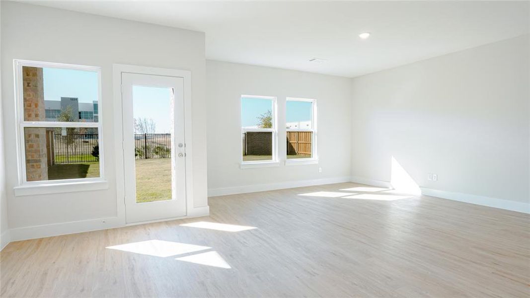 Spare room with light hardwood / wood-style floors