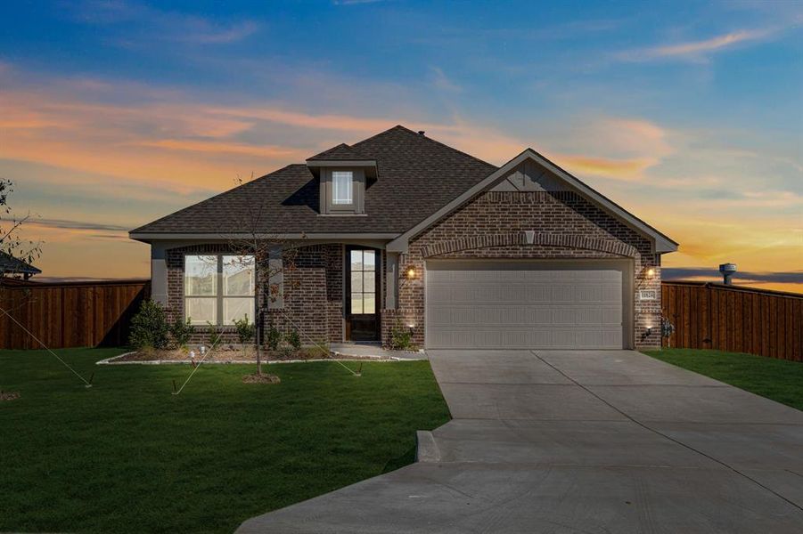 Front exterior of a new home in Wildcat Ridge Phase 3, Godley, TX, highlighting curb appeal (Image 1). Front exterior of a new home in Wildcat Ridge Phase 3, Godley, TX, highlighting curb appeal (Image 1).