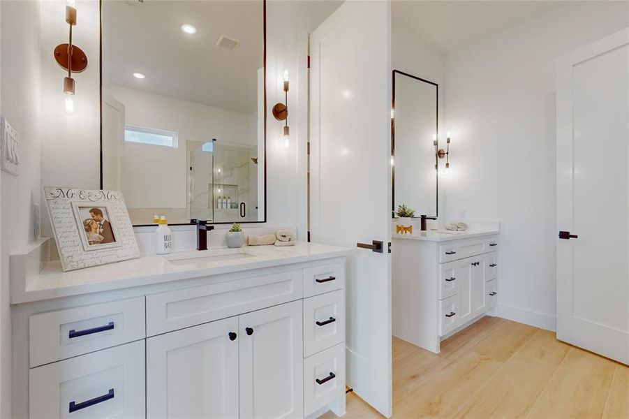 Main Bathroom featuring hardwood / wood-style floors and vanity