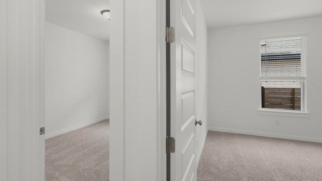 Representative unfurnished interior of a home built from the Bryson by Chesmar Homes in Newhaven, Manor (Image 18).