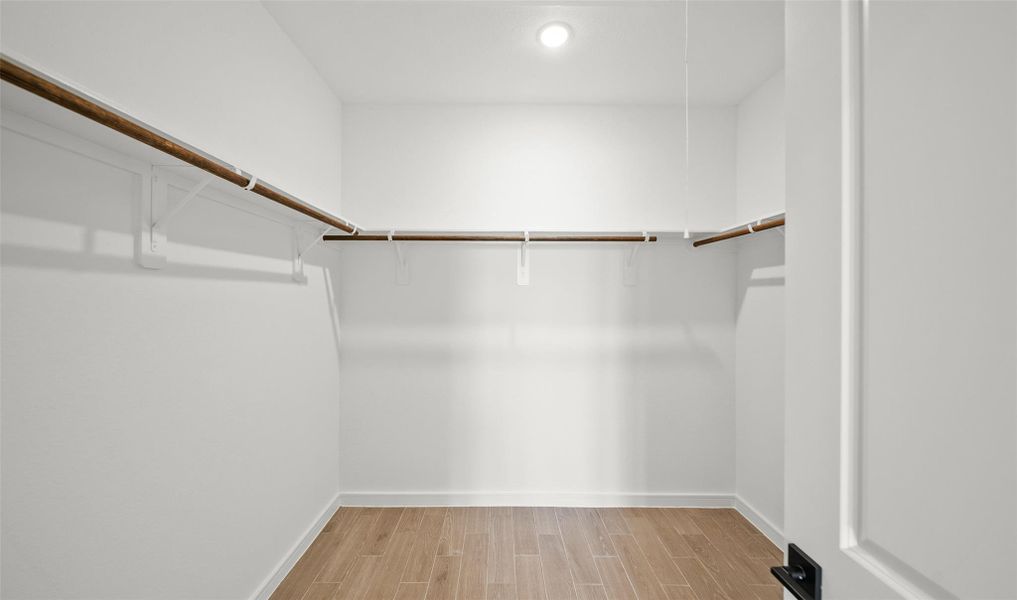 Primary walk-in closet (*Photo not of actual home and used for illustration purposes only.)