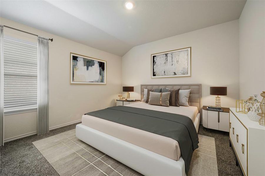 Carpeted bedroom with lofted ceiling and baseboards
