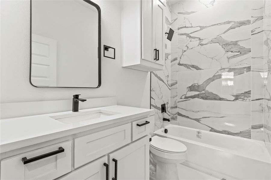 Bathroom featuring vanity and bathtub / shower combination