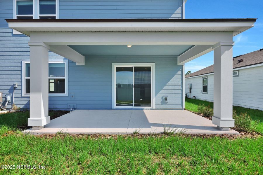 Front exterior of a new home in Wells Landing, Jacksonville, FL, highlighting curb appeal (Image 21).