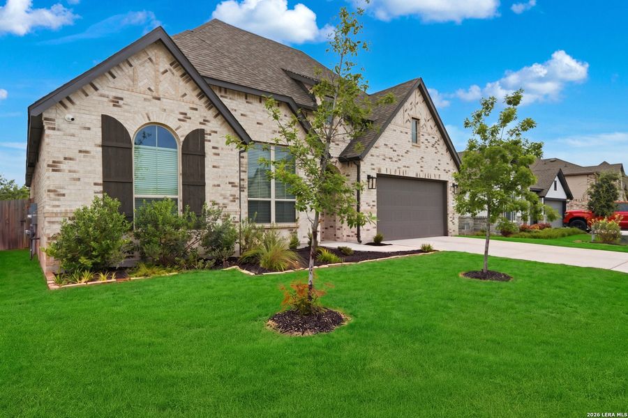 Front exterior of a new home in Davis Ranch, San Antonio, TX, highlighting curb appeal (Image 22).