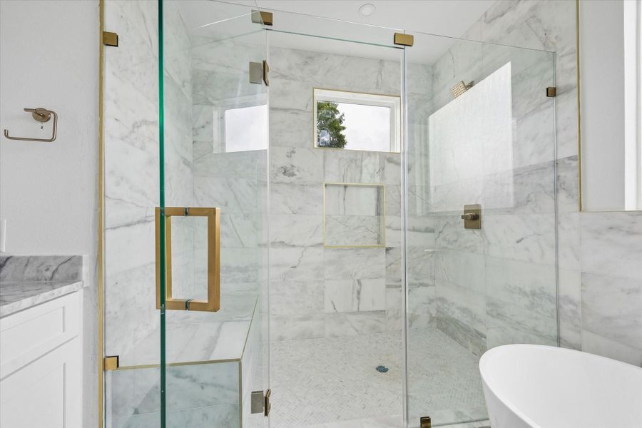 Enjoy starting or ending your day in this luxurious glass-enclosed shower.